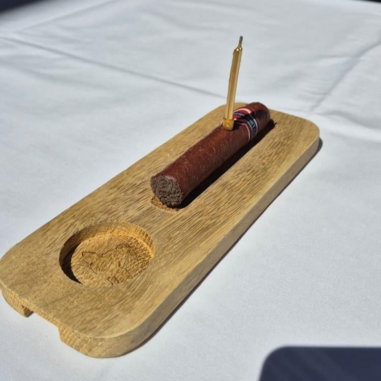 The signature birthday cigar dessert at Pimiento Argentino Grill