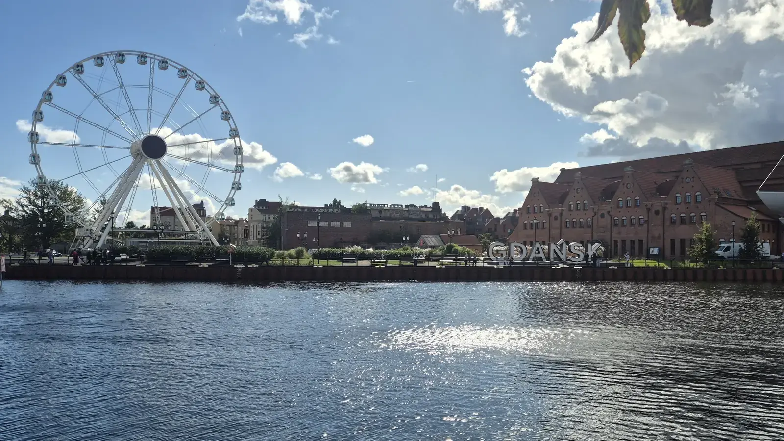 Gdańsk Motława waterfront with the AmberSky Ferris wheel and GDAŃSK letters